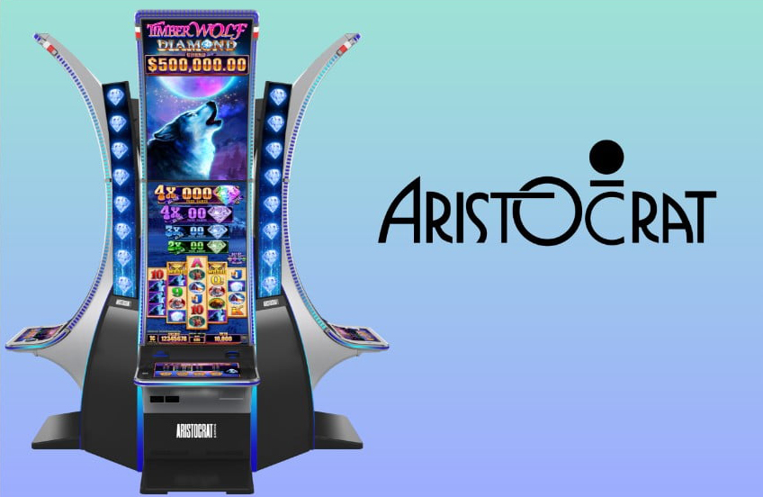 A slot machine with the Aristocrat Gaming Logo next to it on a blue-green background